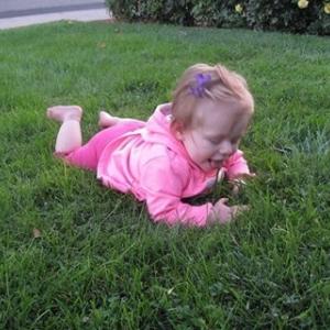Granddaughter discovering the wonders of grass